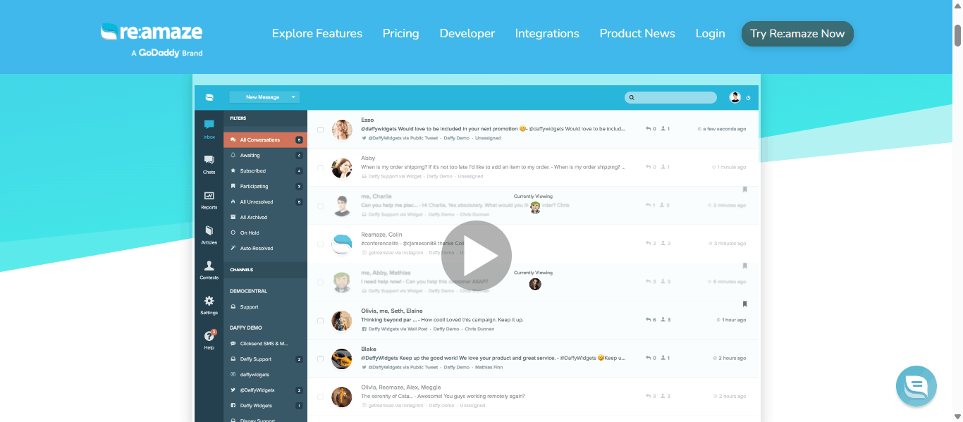 Re:amaze unified inbox dashboard showing live chat, email, SMS, Twitter, Instagram, and Facebook conversations in one GoDaddy-branded support workspace.